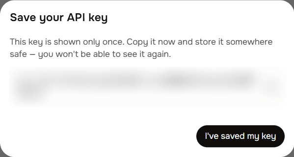 The Save your API key window showing the new key with a copy button
